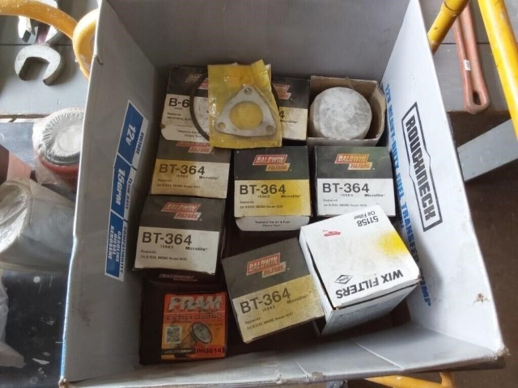 Box of oil filters and parts