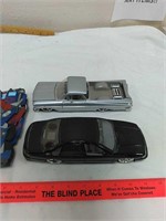 Two diecast cars and Optimus prime