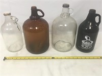 Lot of four glass jugs.
