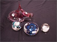 Four crystal paperweights: 7" high cranberry and