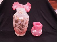 Two opaque pink and white vases decorated with