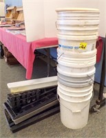 STACK OF 5 GAL PAILS & PLANTER TRAYS