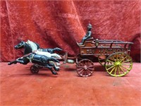 Antique cast iron horse drawn fire patrol wagon.