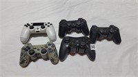 5 play station controllers