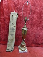 Brass table lamp, US Army canvas bag.