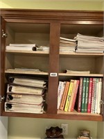 Cabinet contents - cookbooks, photo albums