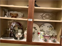 Cabinet contents - plates, candle holders,