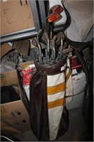 brown golf bag and clubs