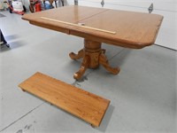 Wood dining room table w/2 leaves (one is hidden u