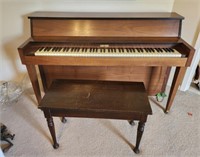 Currier piano and piano bench