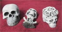 (3) Small concrete skull statues.