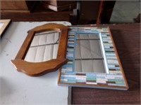 2 small framed mirrors