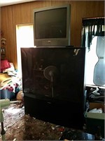 Two large televisions, including a Sanyo and a