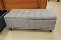 Grey ottoman with hinged lid