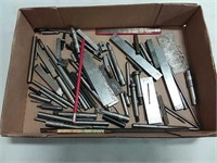assortment of reamers and drill bits