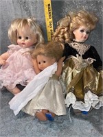 (E) Three dolls ( Black and gold dress is