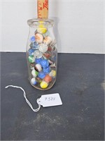 Vintage seal test milk bottle with marbles