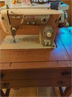 De Luxe Zig Zag Vintage sewing machine in cabinet