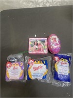 McDonald's barbies and Russell Stover tins