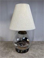Glass globe table lamp with duck mount decoration