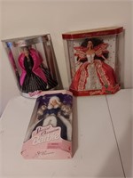 3 Barbie dolls in the box.
