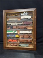 Wooden shadow box with multiple CN train cars