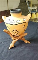 Arizona pottery in a nice wood stand approx 7