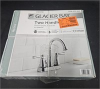 Glacier Bay 4" two handled bathroom faucet.