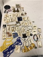 Costume jewelry. Assorted pins, necklaces, pewter