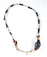 Naga style boar tusk necklace.