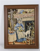 FRAMED CROSS-STITCH OF WOMAN KNITTING AT HOME
