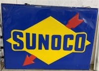 large plastic Sunoco sign encased and lighted