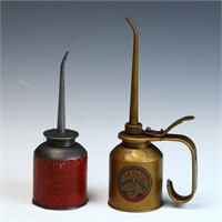 Two vintage oil cans with advertising