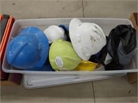 tote with (10) hard hats and set of chaps