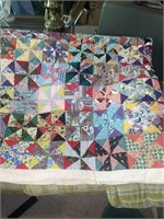 Hand and machine stitched quilt