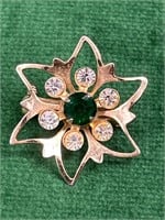 Goldtone, green and clear rhinestone brooch