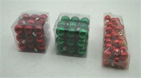Miniature red and green ball ornaments boxes