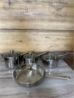 Set of cooks tool pots and pans