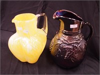 Two contemporary pitchers: 9 1/2" amethyst
