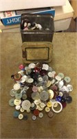 Small tin can full of buttons