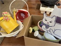 box lot of watering cans, and basket decor
