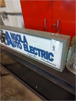 Two signs: Angola Auto Electric, McNeil Akron Bag-