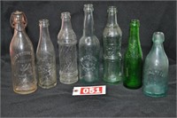 Mostly embossed early soda bottles