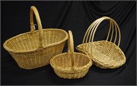Three cane carry baskets
