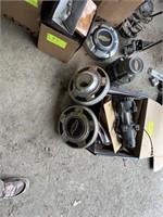 Lot of Chevy hub caps. Box of car lights and