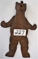 Carved swinging bear, articulating limbs