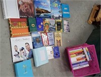 Pink crate of books including new photo