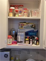 cupboard and one drawer of spices, measuring cups