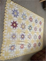 Old handmade hand quilted quilt. Has some stains