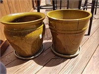2 large green flower pots - one has a crack
